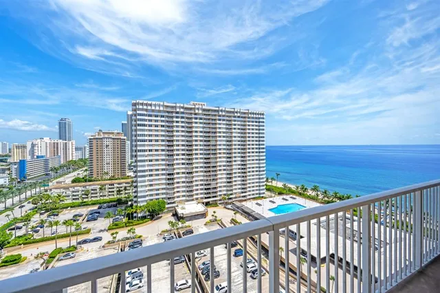 a view of a balcony with an outdoor seating