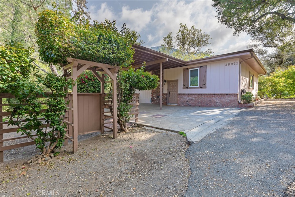 a view of a house with a yard and garage