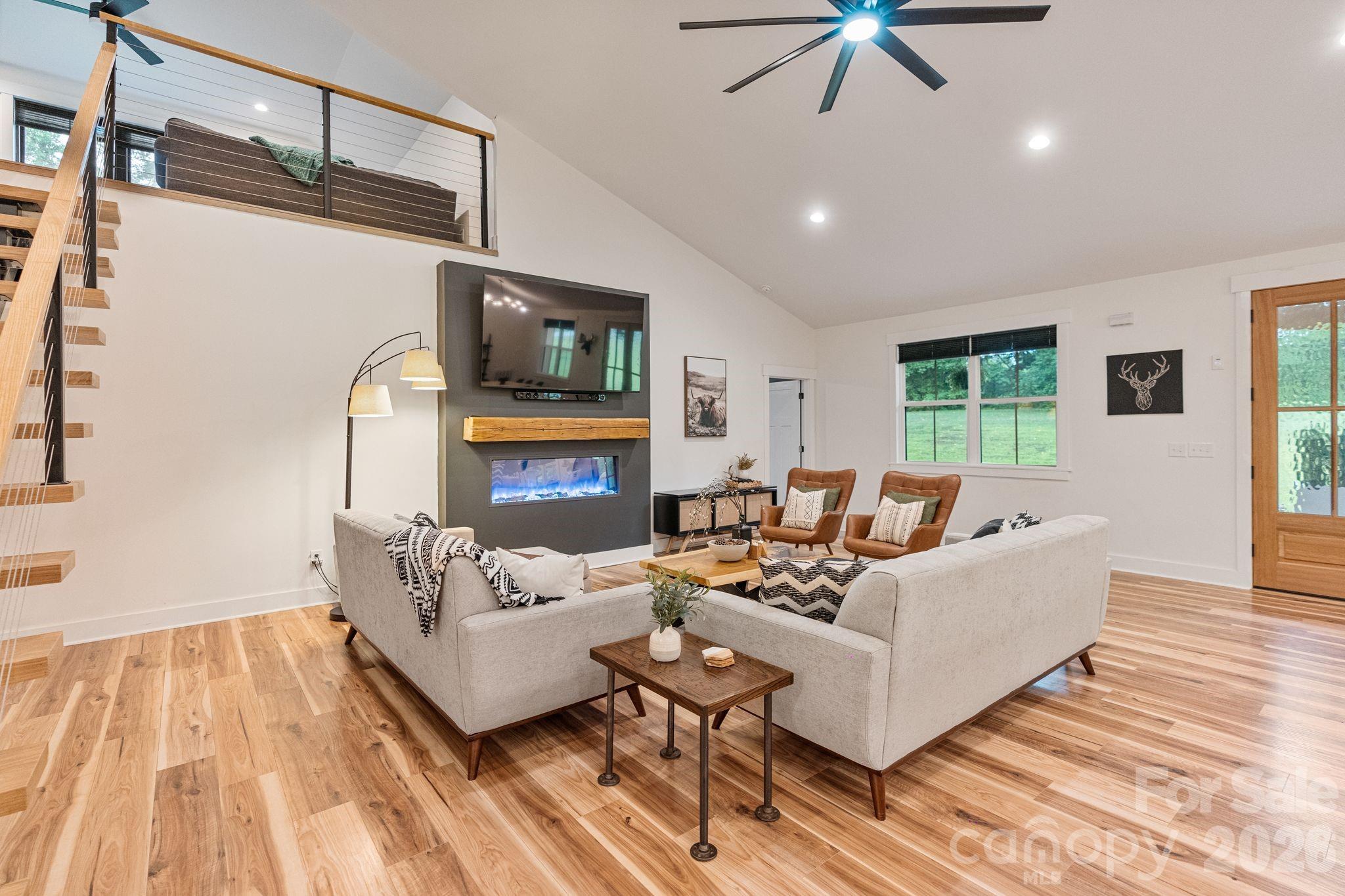 13546 State Highway 55 York, SC 29745 - Photo 18 of 48 a living room with furniture a flat screen tv and a fireplace