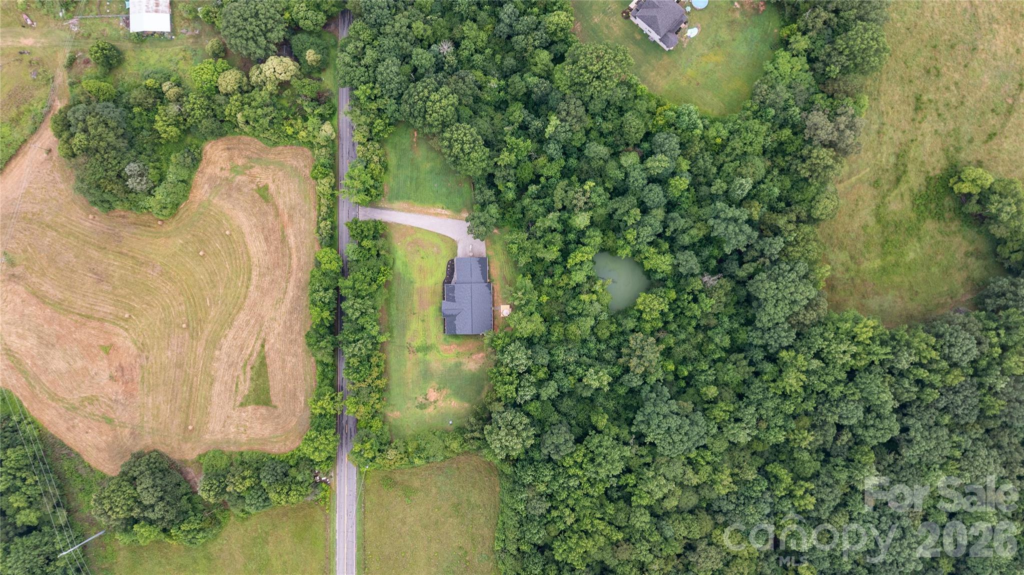 13546 State Highway 55 Clover, SC 29710 - Photo 2 of 48 an aerial view of a house with a yard and large trees