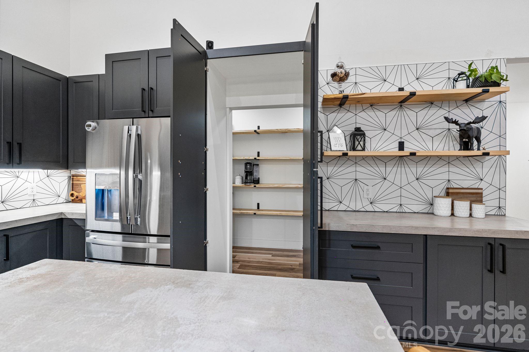 13546 State Highway 55 York, SC 29745 - Photo 24 of 48 a kitchen with stainless steel appliances kitchen island granite countertop a refrigerator and a stove