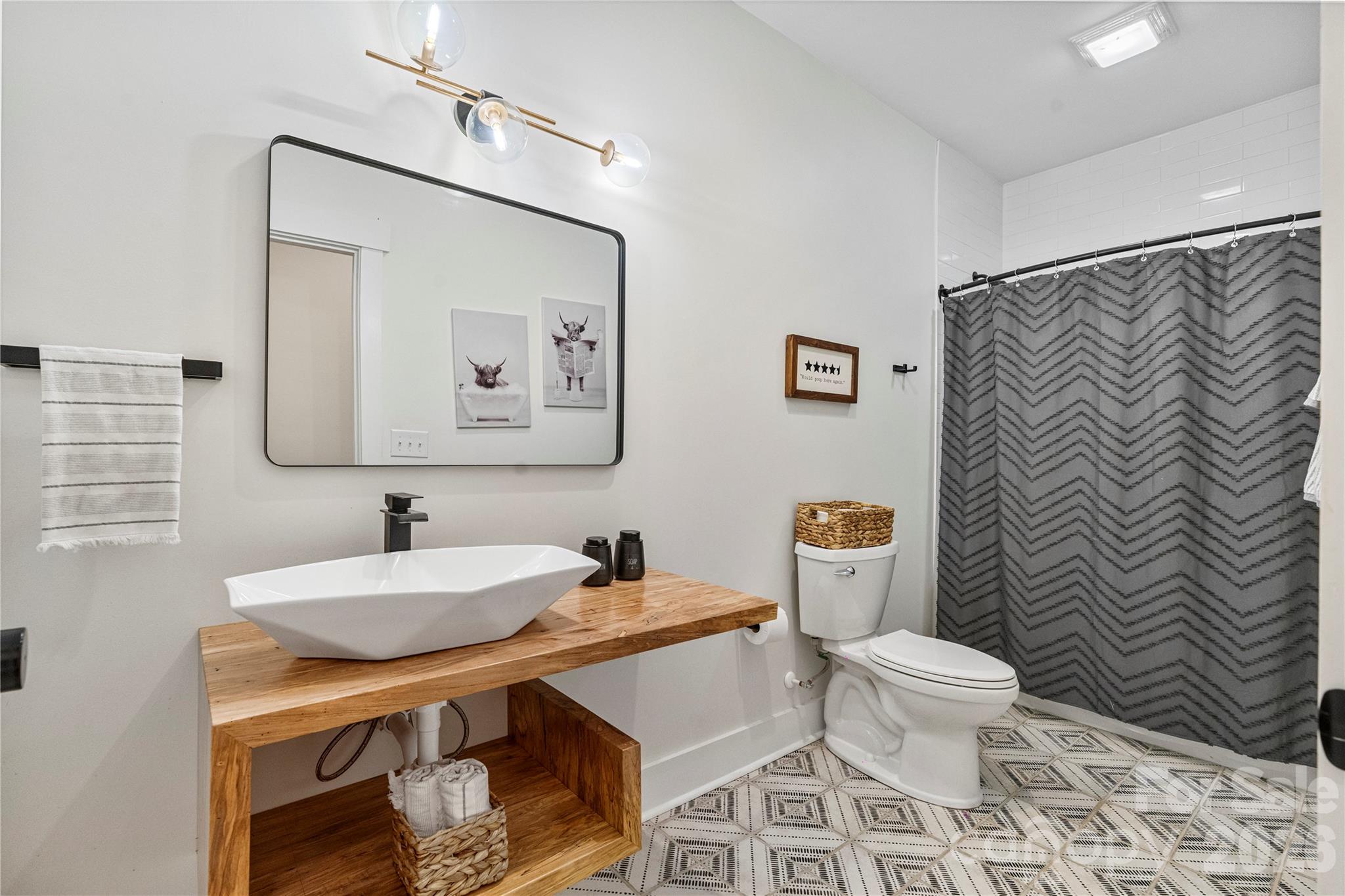 13546 State Highway 55 York, SC 29745 - Photo 41 of 48 a bathroom with a sink a toilet and a mirror