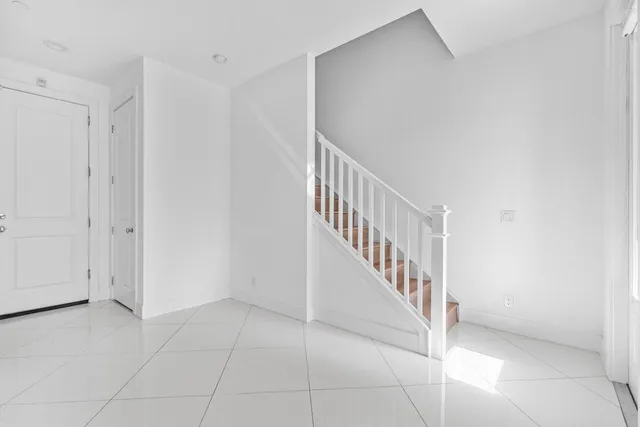 a view of a hallway with staircase