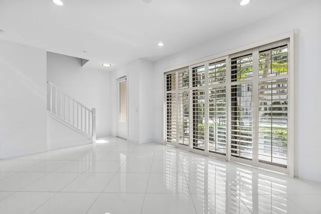 a view of an empty room with a balcony