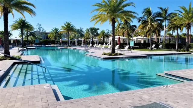a view of outdoor space with swimming pool and lounge chair