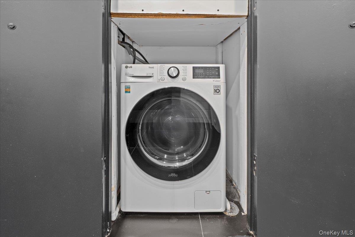 458 East 25th Street, Unit 305 Brooklyn, NY 11226 - Photo 11 of 14 a utility room with dryer and washer