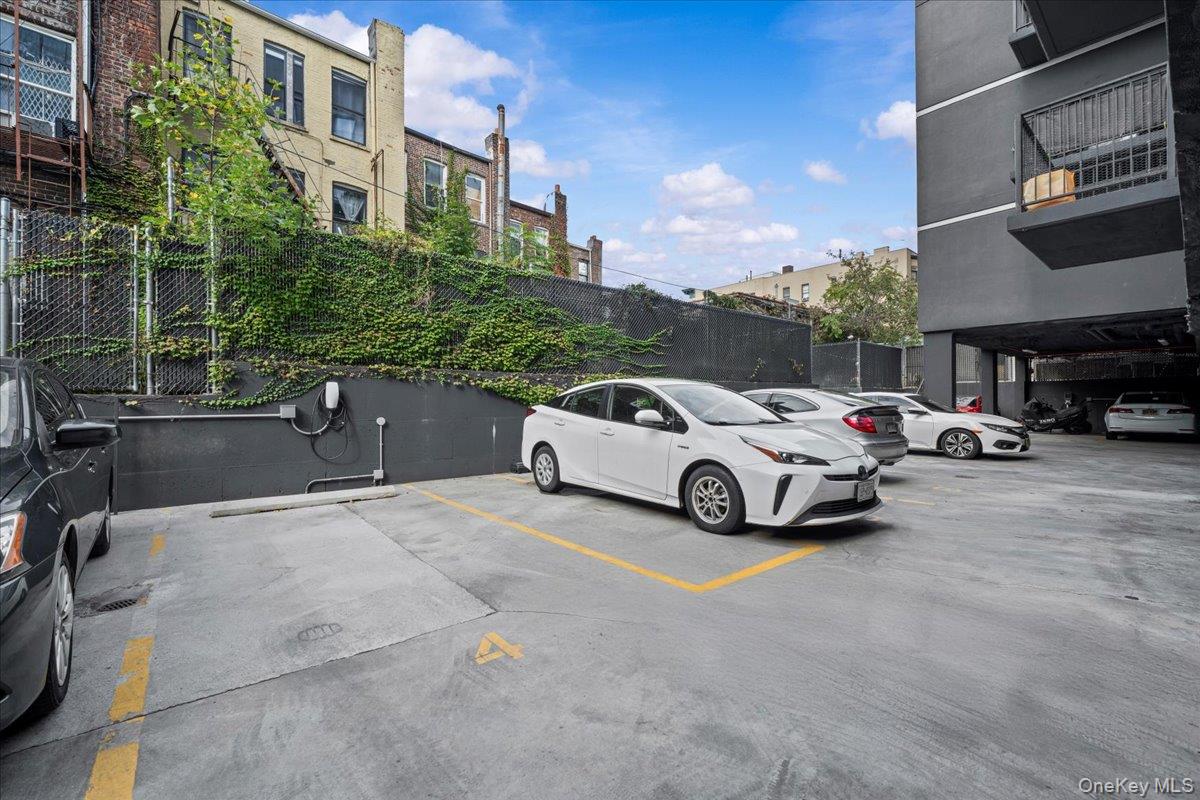 458 East 25th Street, Unit 305 Brooklyn, NY 11226 - Photo 13 of 14 a view of parking with cars parked