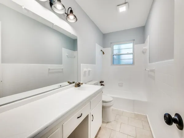 a bathroom with a sink a toilet and a bathtub