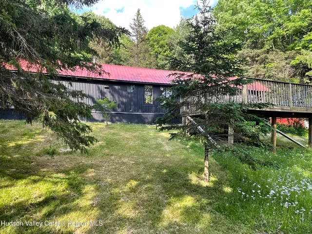 a sign that is in front of a tree