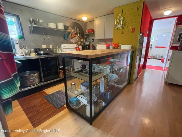 a room with lots of furniture and a fireplace