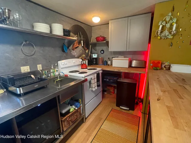 a kitchen with stainless steel appliances granite countertop a stove and a sink