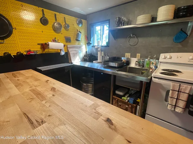 a kitchen with a sink and wooden cabinets