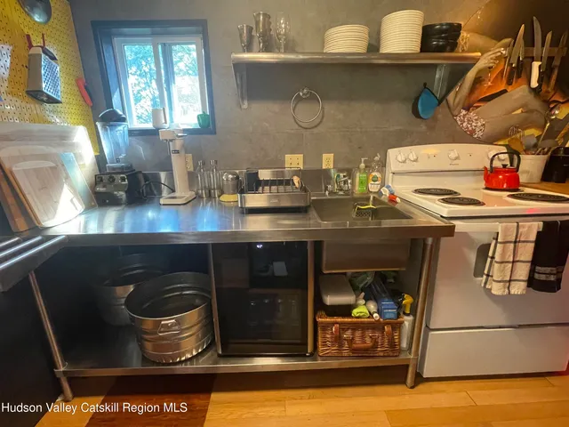 a kitchen with a stove and a sink