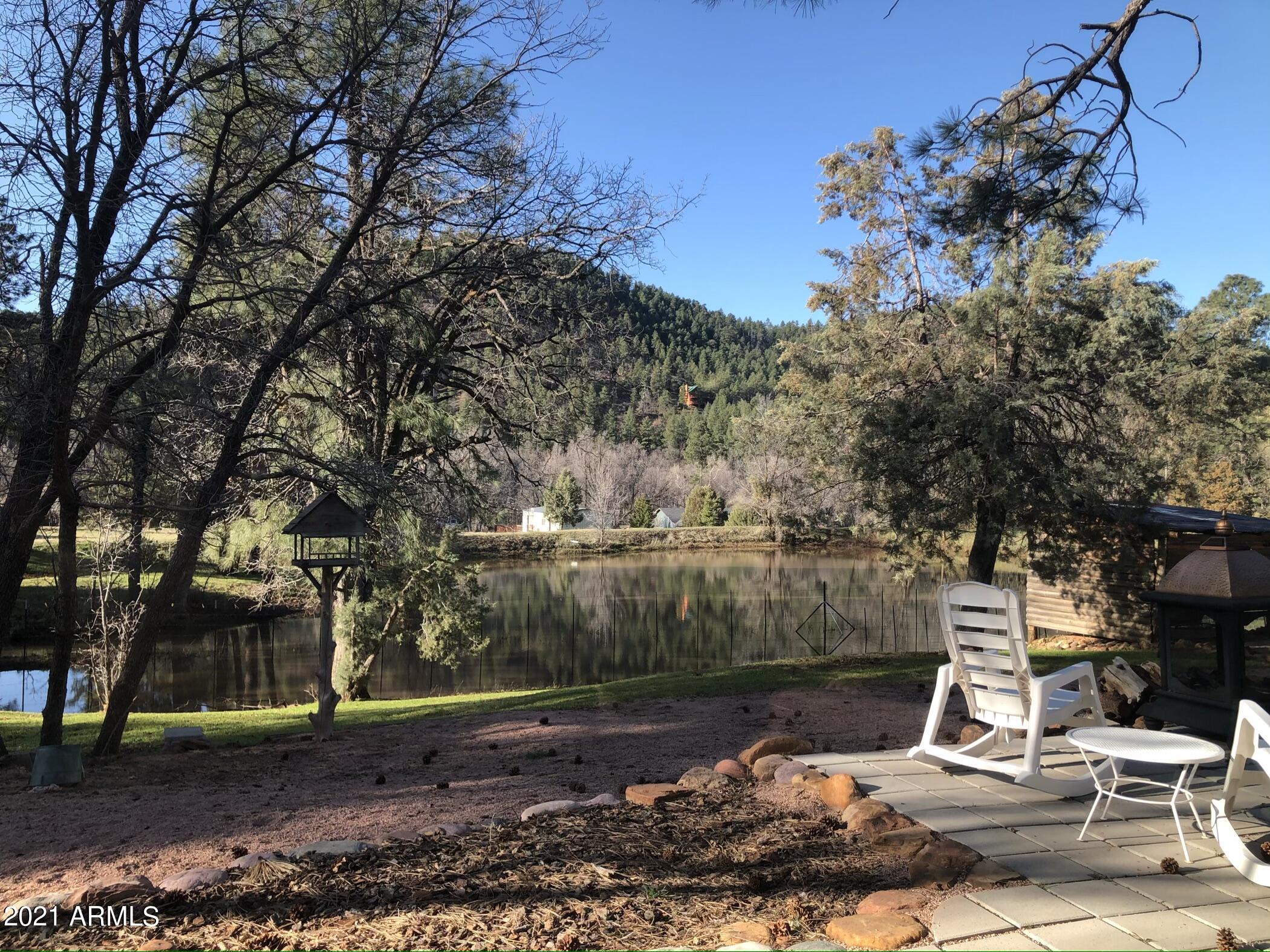 9225 Fossil Creek Road Strawberry, AZ 85544 - Photo 23 of 36 Back patio & full pond