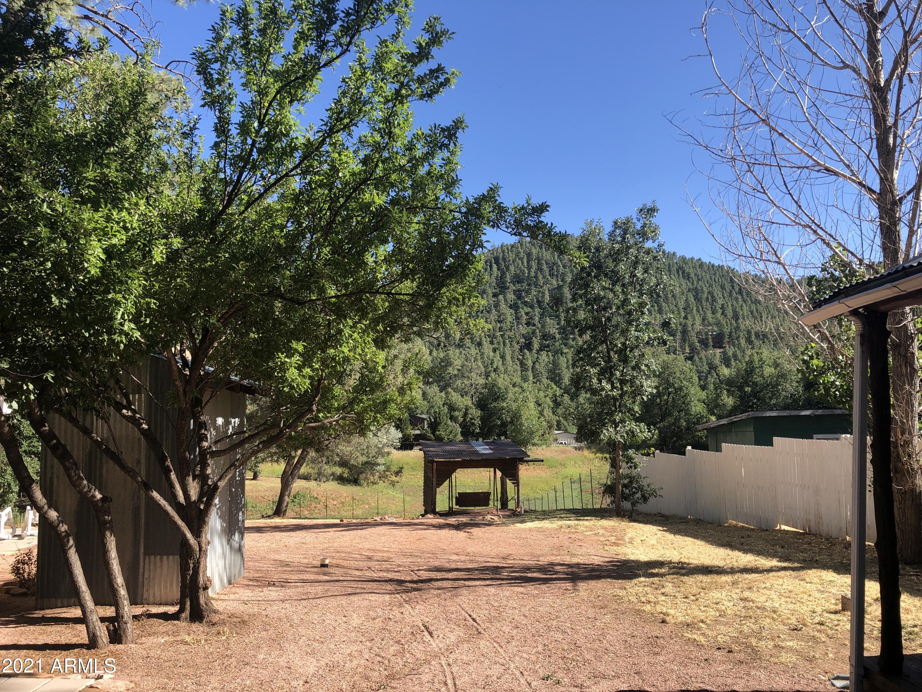 9225 Fossil Creek Road Strawberry, AZ 85544 - Photo 31 of 36 Sunny view of sewing & mountain from she