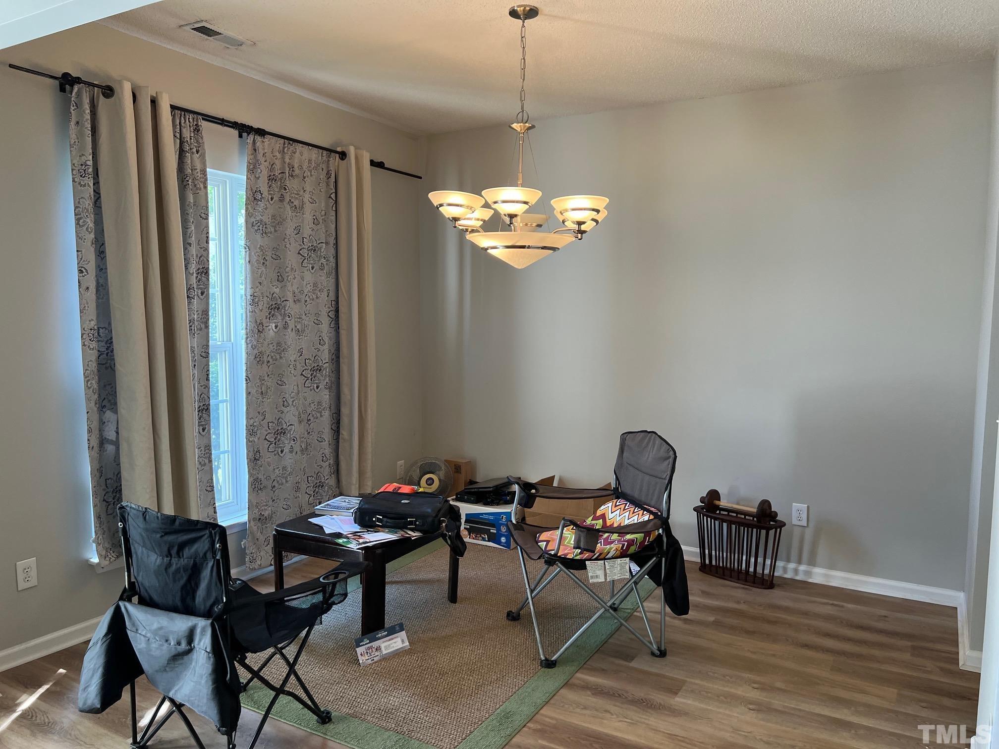 302 Durston Loop Morrisville, NC 27560 - Photo 11 of 21 a view of a livingroom with furniture and a window