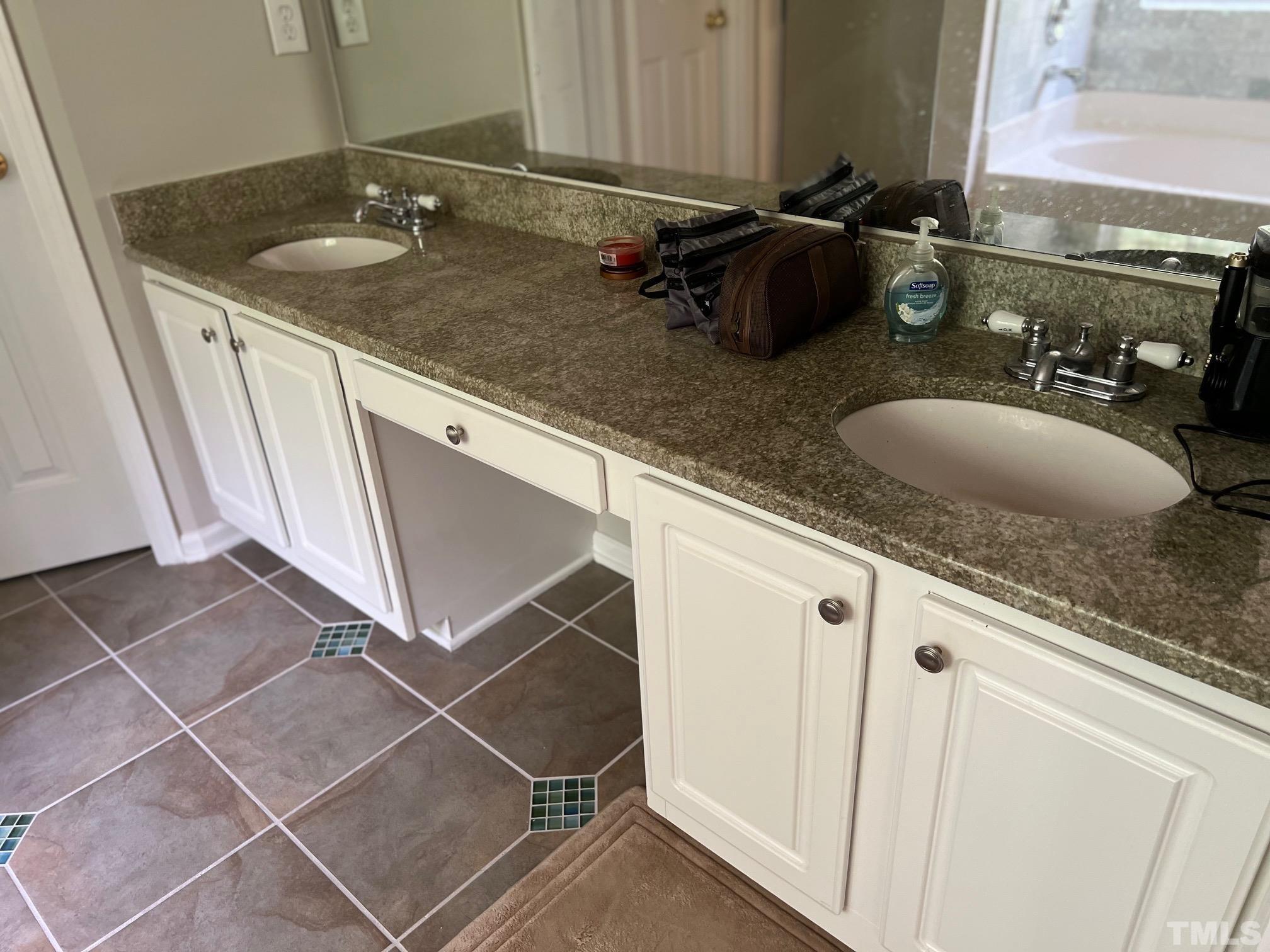 302 Durston Loop Morrisville, NC 27560 - Photo 6 of 21 a bathroom with a granite countertop sink and a mirror