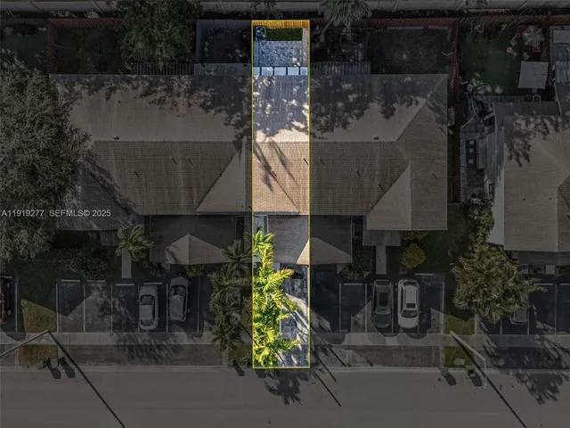 a picture of a house with a yard and sitting area