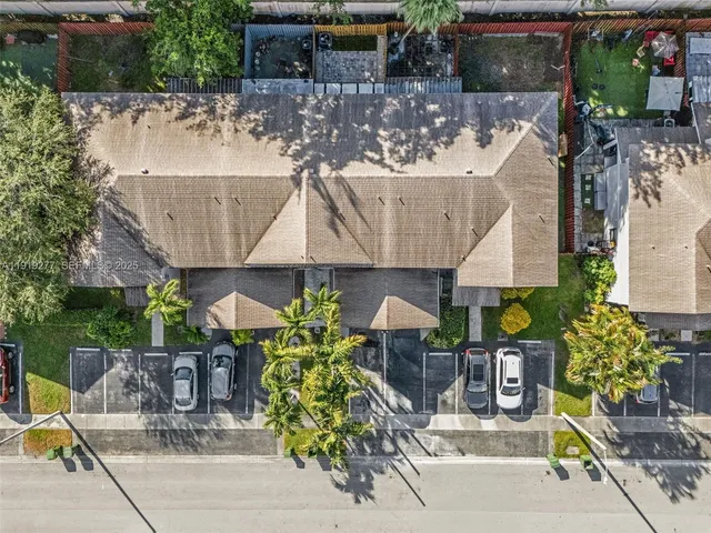 aerial view of a table and chairs under an umbrella