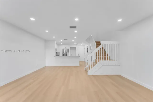 a view of empty room with a projector