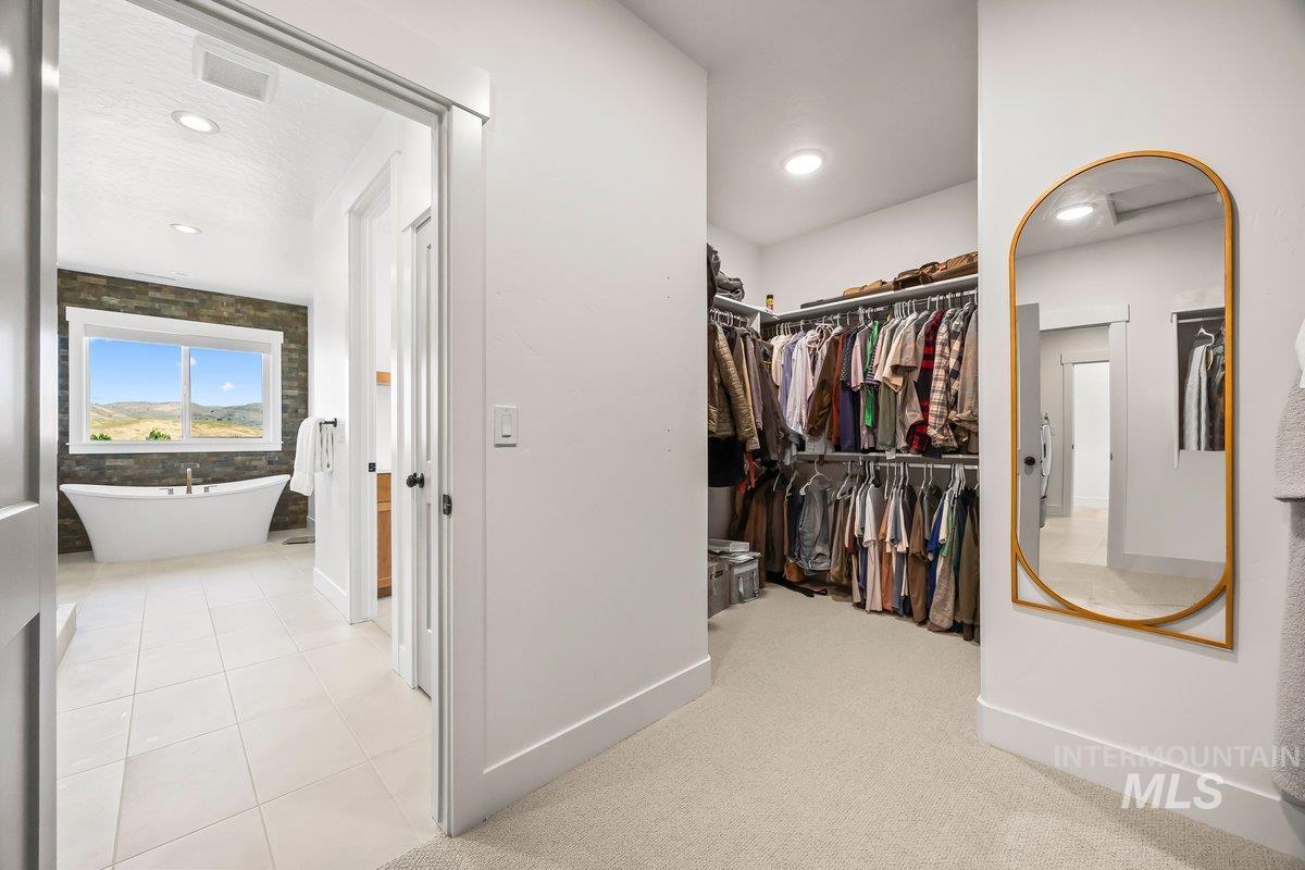 13746 North Ruffed Grouse Way Boise, ID 83714 - Photo 20 of 43 Walk in closet featuring light tile patterned flooring