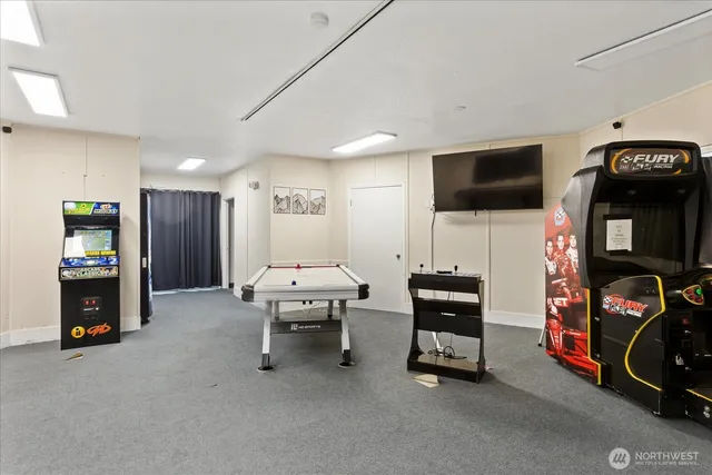 a view of a livingroom with furniture and a flat screen tv