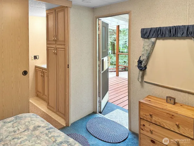 a bedroom with a bed and a dresser