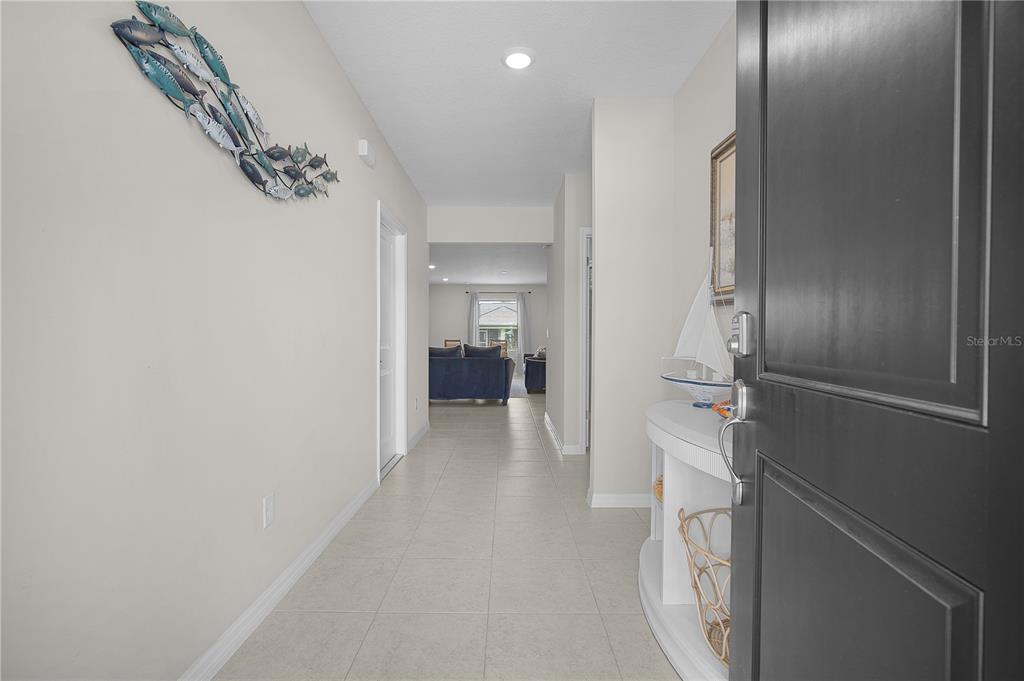 418 Fleming Street Sebastian, FL 32958 - Photo 5 of 38 a view of a hallway with closet and a livingroom view