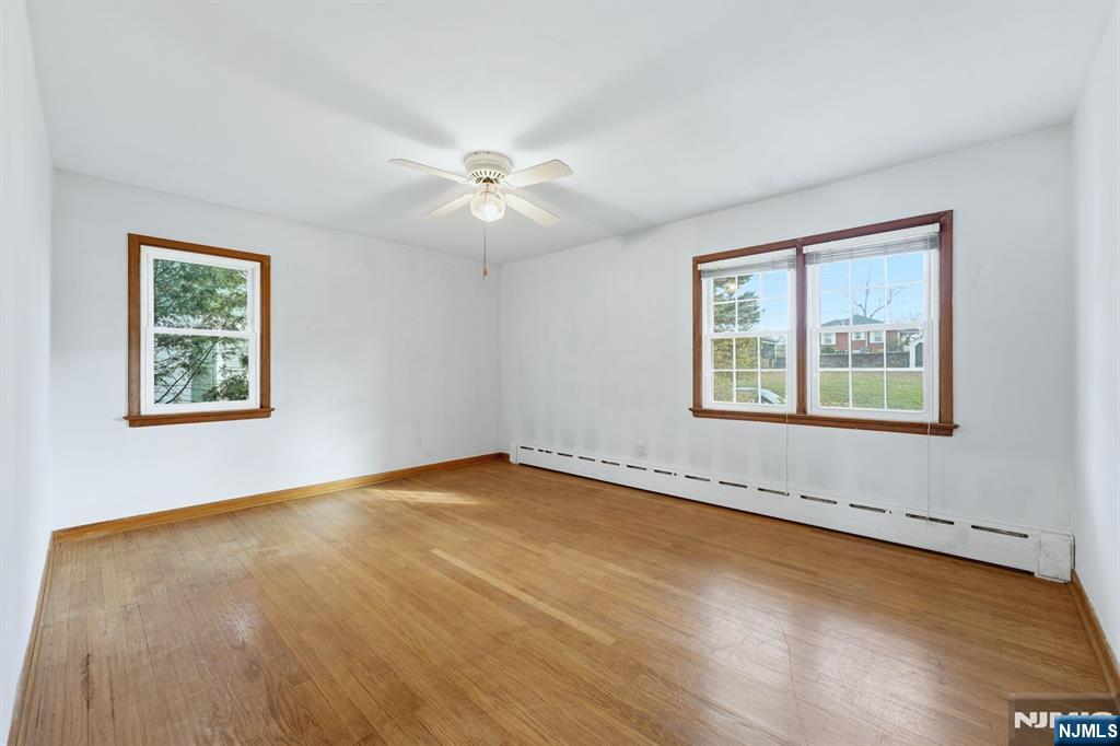 5 Dogwood Road Netcong, NJ 07857 - Photo 15 of 35 a view of an empty room with a window and wooden floor
