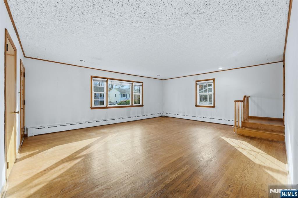 5 Dogwood Road Netcong, NJ 07857 - Photo 6 of 35 an empty room with wooden floor and windows