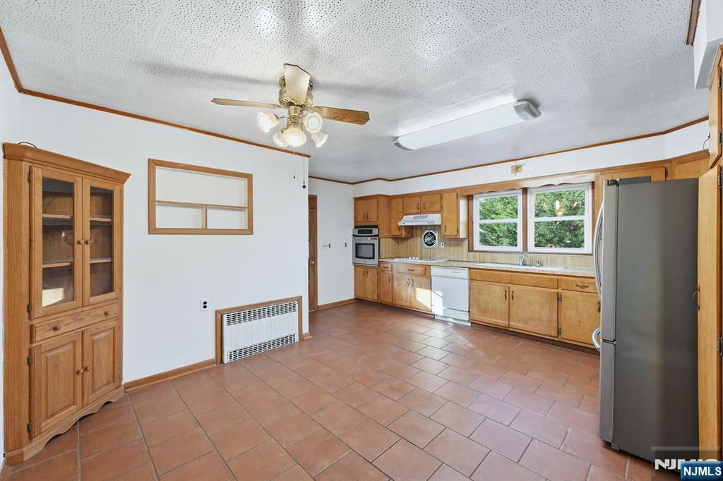 5 Dogwood Road Netcong, NJ 07857 - Photo 8 of 35 a kitchen with stainless steel appliances granite countertop a refrigerator and a stove top oven