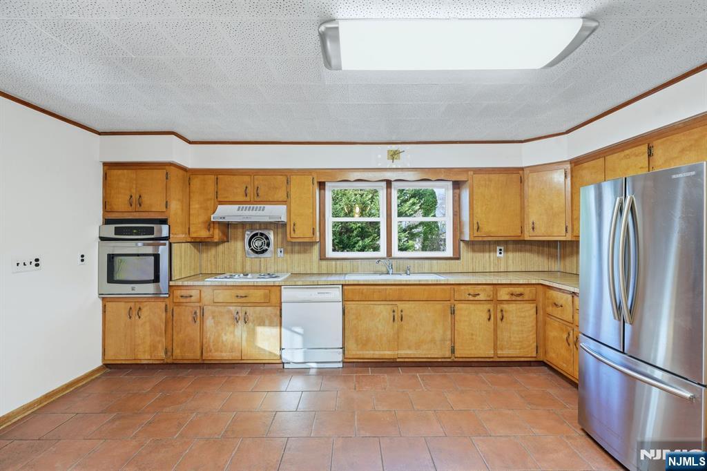 5 Dogwood Road Netcong, NJ 07857 - Photo 9 of 35 a kitchen with stainless steel appliances granite countertop a refrigerator and a stove top oven