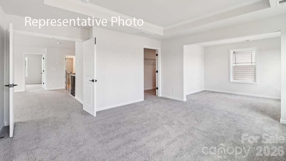 7621 Bainbridge Road Sherrills Ford, NC 28673 - Photo 26 of 34 an empty room with windows and closet