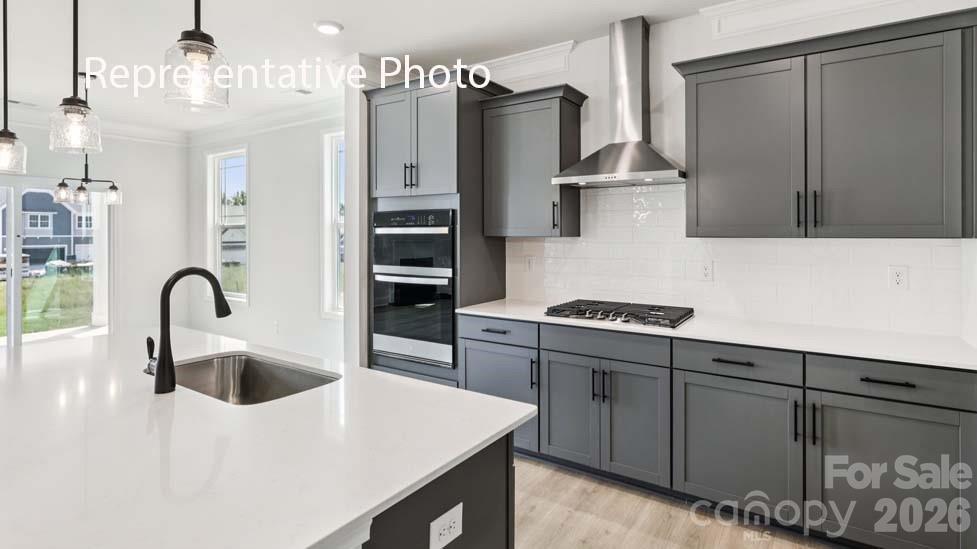 7621 Bainbridge Road Sherrills Ford, NC 28673 - Photo 8 of 34 a kitchen with stainless steel appliances a sink a stove and refrigerator