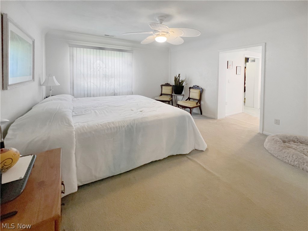 4663 East Harbor Road Port Clinton, OH 43452 - Photo 17 of 31 Carpeted bedroom featuring ceiling fan