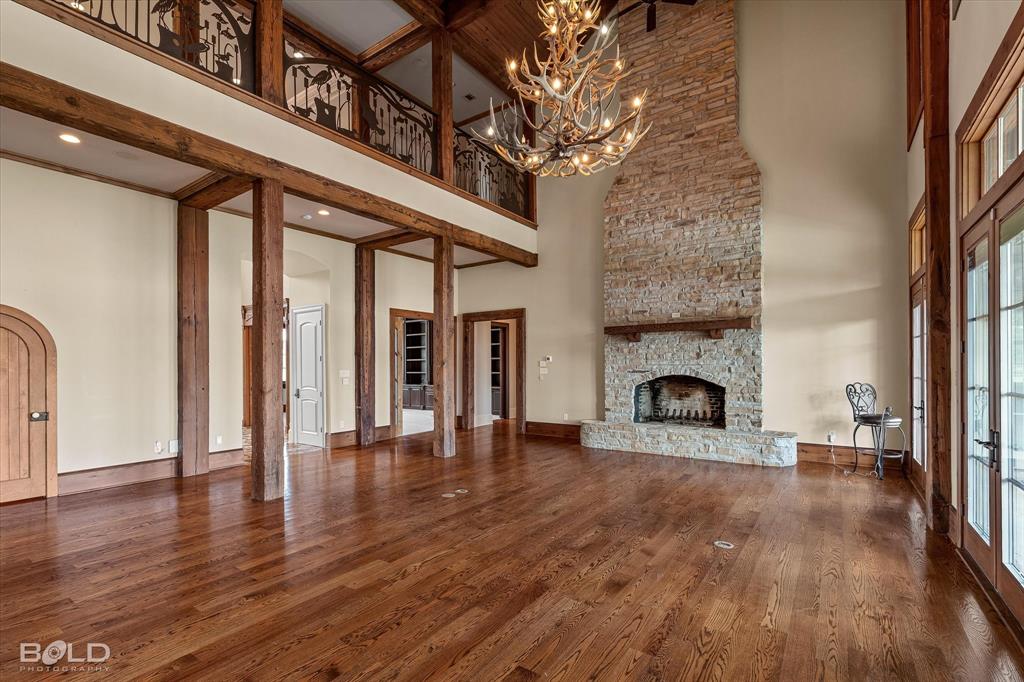 10099 Ferry Lake Road Oil City, LA 71061 - Photo 5 of 14 Spacious great room with fireplace and stunning architectural details