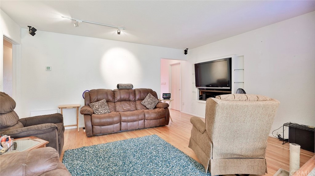 1102 Eucalyptus Drive El Cajon, CA 92020 - Photo 11 of 63 a living room with furniture and a flat screen tv