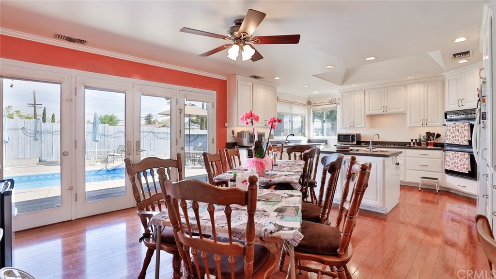 1102 Eucalyptus Drive El Cajon, CA 92020 - Photo 12 of 63 a view of a dining room with furniture window and wooden floor
