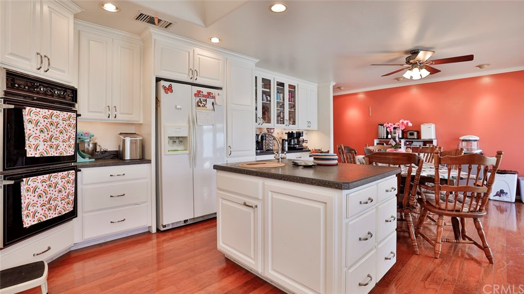 1102 Eucalyptus Drive El Cajon, CA 92020 - Photo 18 of 63 a kitchen with stainless steel appliances granite countertop a sink stove and refrigerator