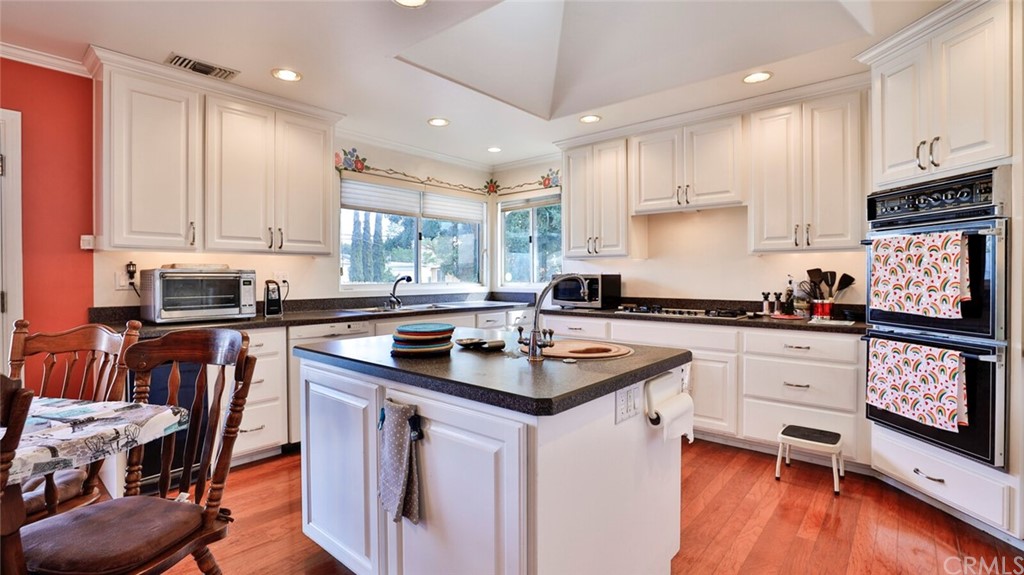 1102 Eucalyptus Drive El Cajon, CA 92020 - Photo 19 of 63 a kitchen with stainless steel appliances granite countertop a stove a sink and a refrigerator