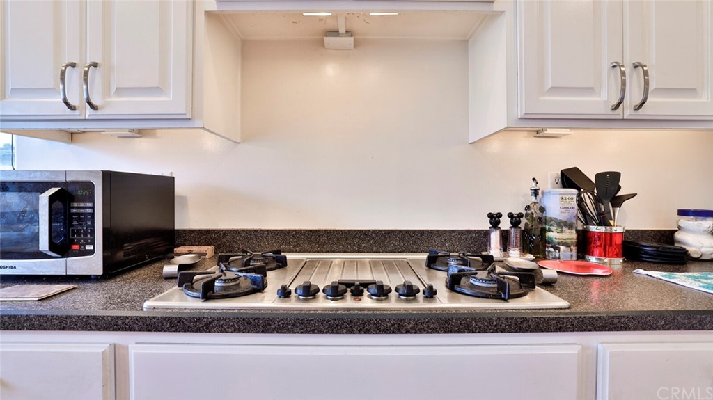 1102 Eucalyptus Drive El Cajon, CA 92020 - Photo 20 of 63 a kitchen with a stove and a sink