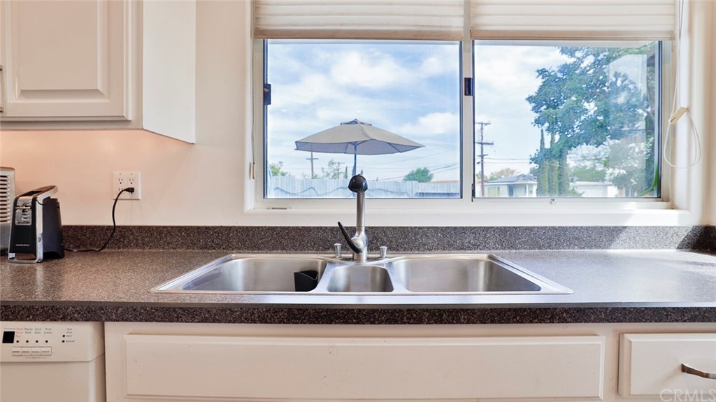 1102 Eucalyptus Drive El Cajon, CA 92020 - Photo 22 of 63 a kitchen with a sink and a window
