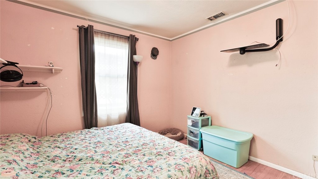 1102 Eucalyptus Drive El Cajon, CA 92020 - Photo 29 of 63 a bedroom with a bed and a table