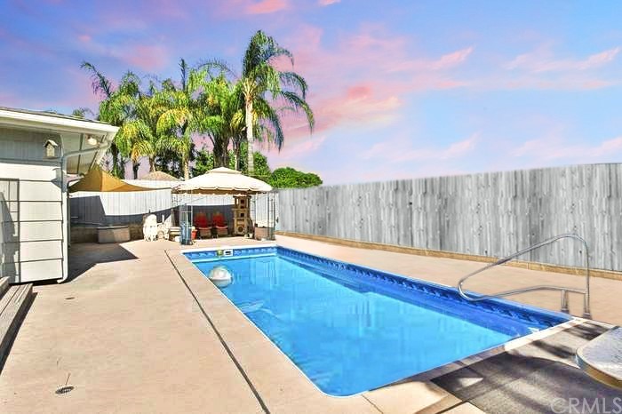 1102 Eucalyptus Drive El Cajon, CA 92020 - Photo 3 of 63 a view of a swimming pool with an outdoor space