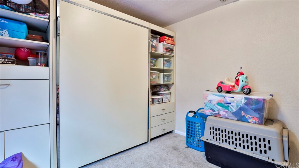 1102 Eucalyptus Drive El Cajon, CA 92020 - Photo 37 of 63 a living room with furniture and baby crib