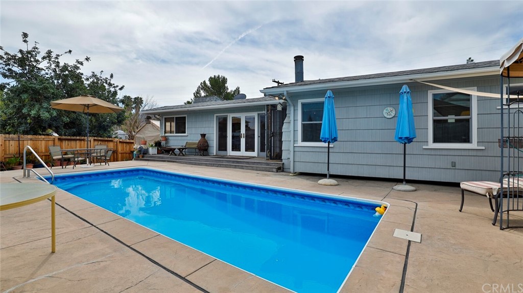 1102 Eucalyptus Drive El Cajon, CA 92020 - Photo 44 of 63 a view of a house with swimming pool and sitting area