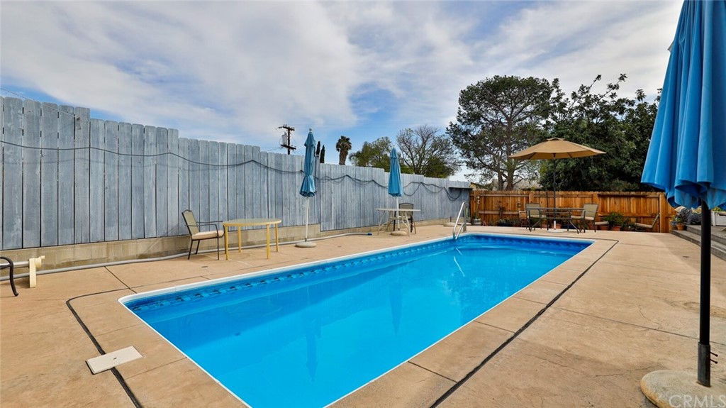 1102 Eucalyptus Drive El Cajon, CA 92020 - Photo 46 of 63 a view of a swimming pool with a lounge chair