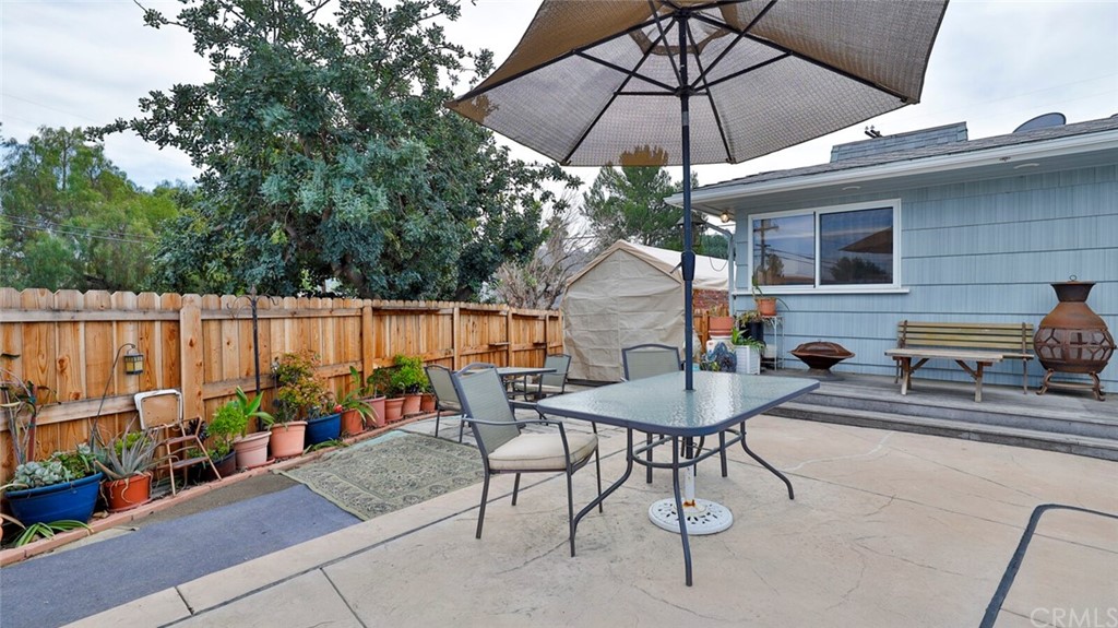 1102 Eucalyptus Drive El Cajon, CA 92020 - Photo 49 of 63 a backyard of a house with table and chairs