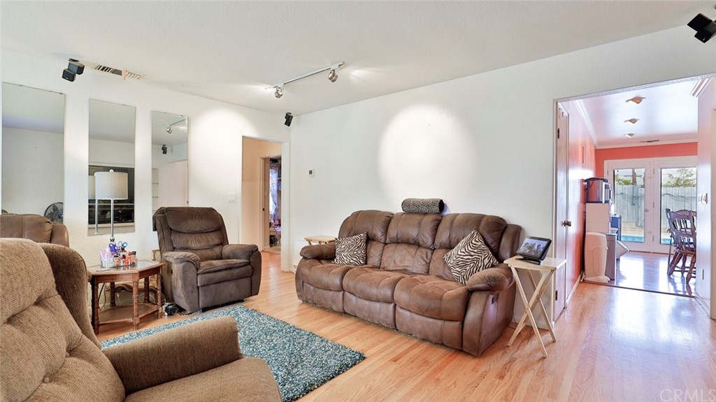 1102 Eucalyptus Drive El Cajon, CA 92020 - Photo 8 of 63 a living room with furniture and a wooden floor