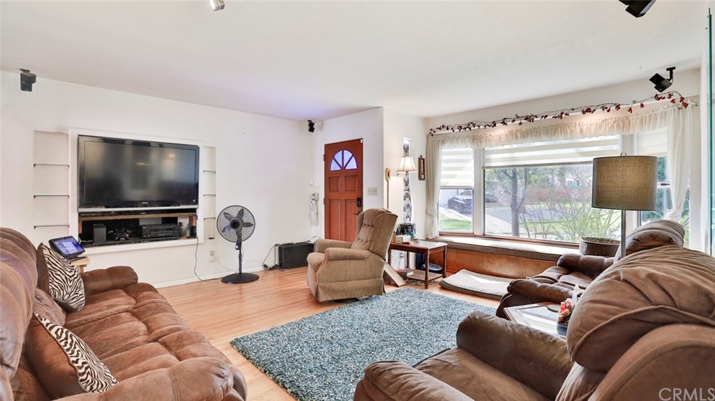 1102 Eucalyptus Drive El Cajon, CA 92020 - Photo 9 of 63 a living room with furniture and a flat screen tv